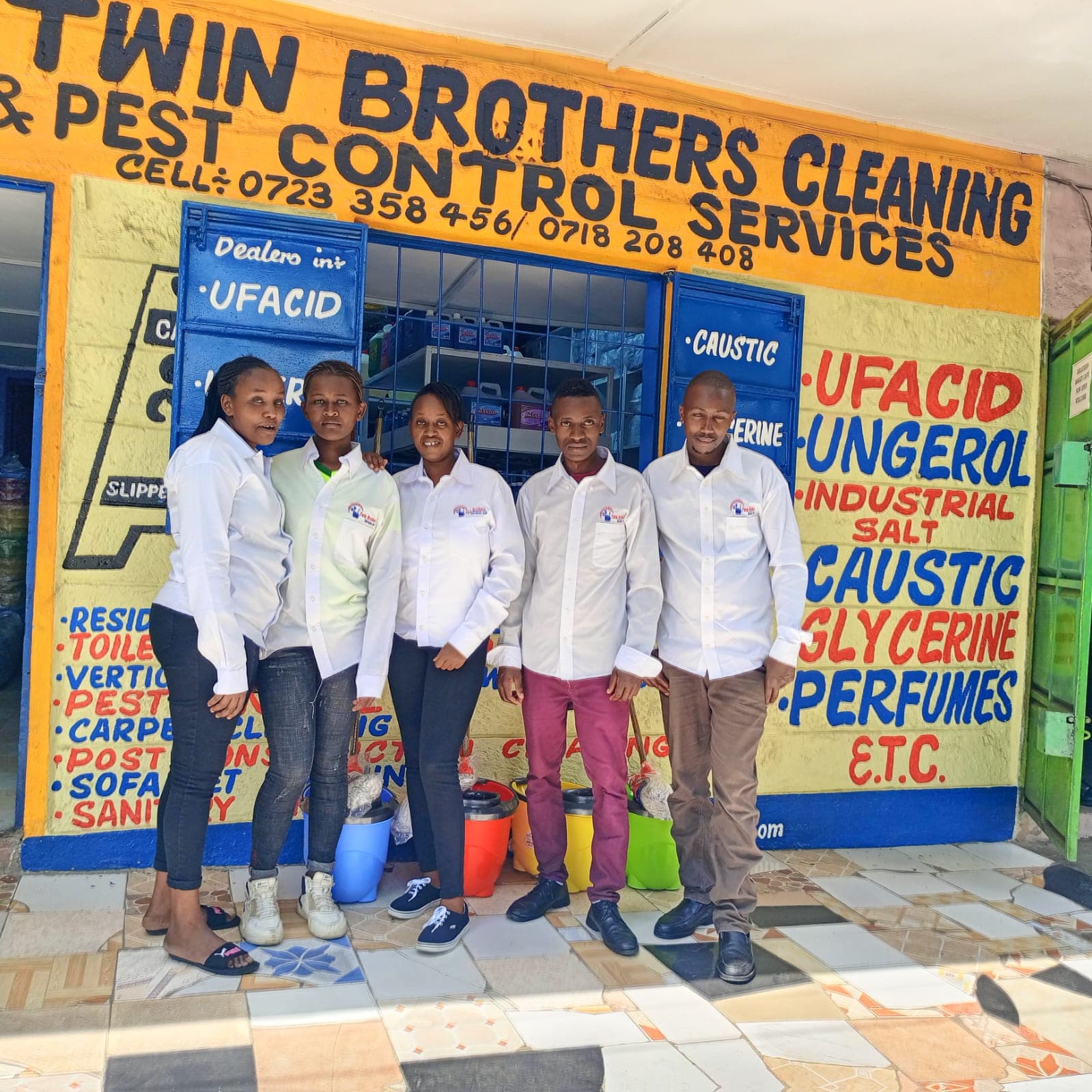 The Twin Brothers Cleaning & Pest Control Services team outside their Nakuru shopfront